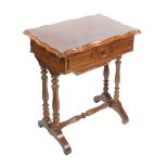 A late 19th Century French walnut sewing table, the hinged rectangular top opening to reveal a re-