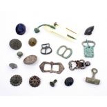 A small group of excavated buckles etc, comprising a Bronze Age bronze toggle, a medieval bronze