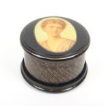 Mauchline ware _ sewing a fortune telling reel box of circular form, black ground, the domed lid