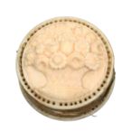 A good early 19th Century carved ivory disc form pin cushion each side well and deeply carved with a