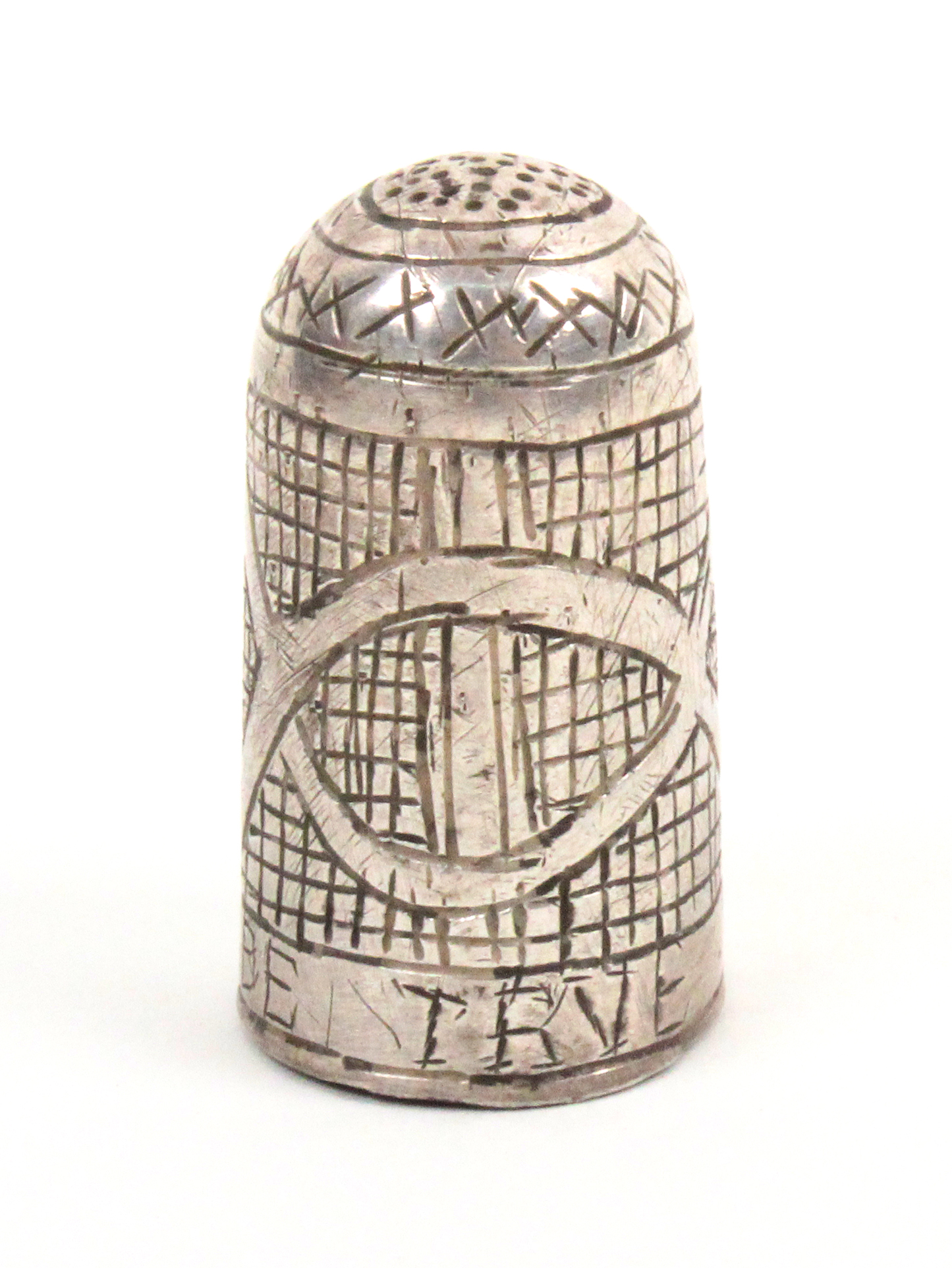 A 17th Century English silver thimble, the body with diamond and oval motifs over a scratched