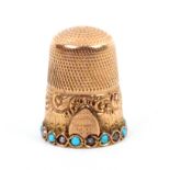A gold thimble dated 1900 the broad freize with a shield cartouche engraved ïKM From Her God