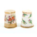Two 19th Century English porcelain thimbles comprising an example painted with groups of colourful
