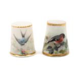 Two early 20th Century porcelain thimbles by Worcester, comprising an example painted with a red