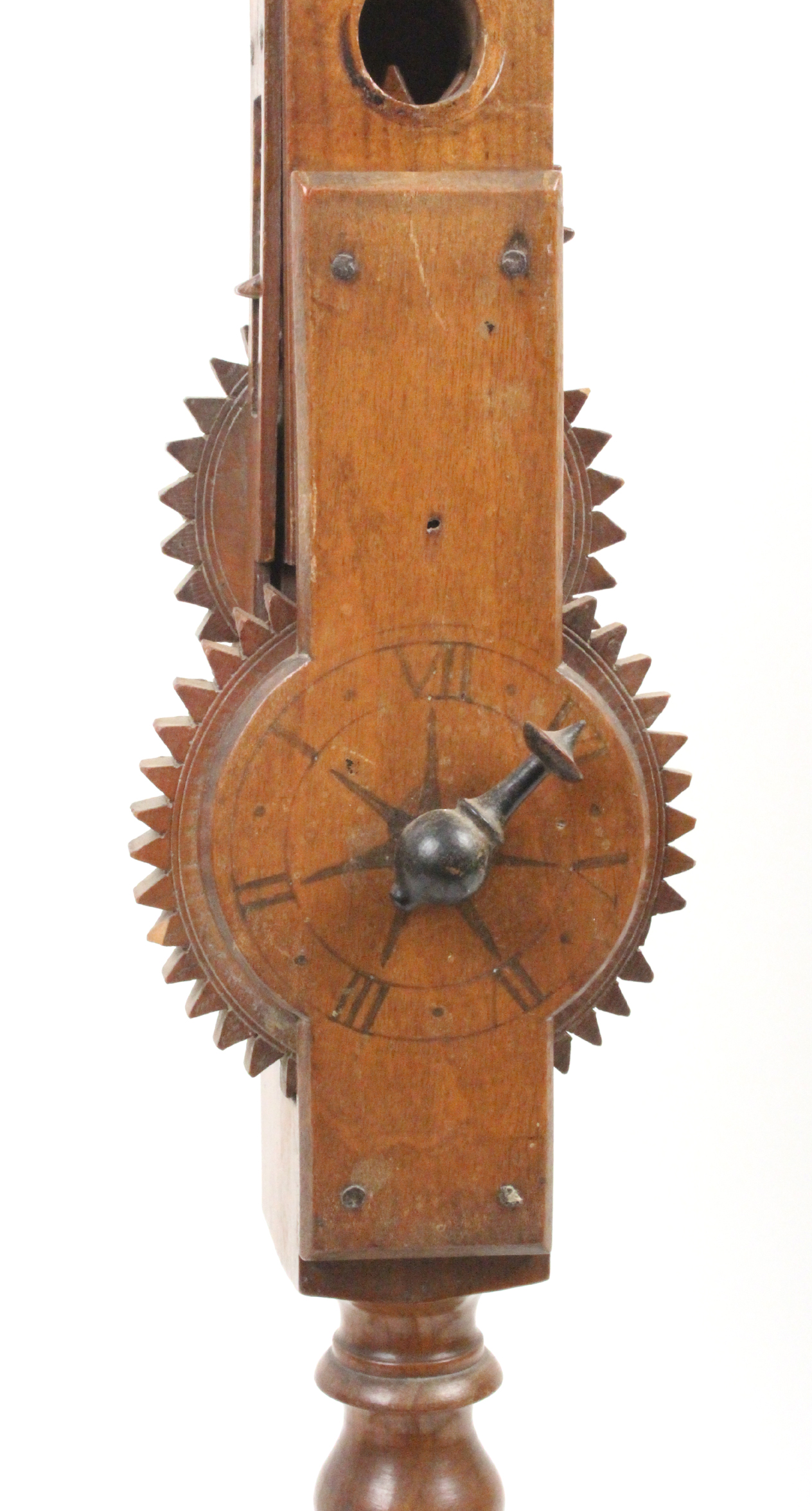 An early 19th Century walnut or fruitwood wool winder the bobbin turned frame on four bun feet