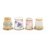 Four English porcelain thimbles all 19th Century or early 20th Century comprising a Royal