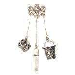 A small composite Chatelaine with three accessories, the pin mount pierced and cast with cherub