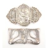 Two early 20th Century continental silver buckles, each in two parts comprising a large example with