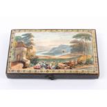 A late 19th Century etui in paper and card of rectangular form with colour landscape to lid,