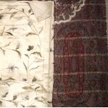 A mixed lot textiles comprising a printed Paisley style shawl, a silk embroidered bed throw