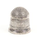 A silver thimble, probably English, late 18th Century, domed waffle top over a beaded decorated