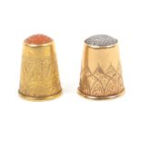Two Swedish gold thimbles comprising an 18 ct example with plain body engraved with a broad
