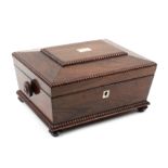 An early Victorian rosewood sewing box of sarcophagus form, split bobbin mouldings, turned