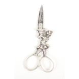 A pair of 19th Century silver scissors, probably Dutch, the closed arms forming a carnival figure or