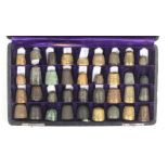 A collection of thirty six excavated thimbles 15th Century and later in various metals contained