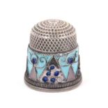 A Russian silver and cloissone enamel thimble, the broad pale blue border with triangular motifs,