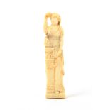 An early 19th Century French carved ivory figural needlecase in the form of a vestal virgin, a