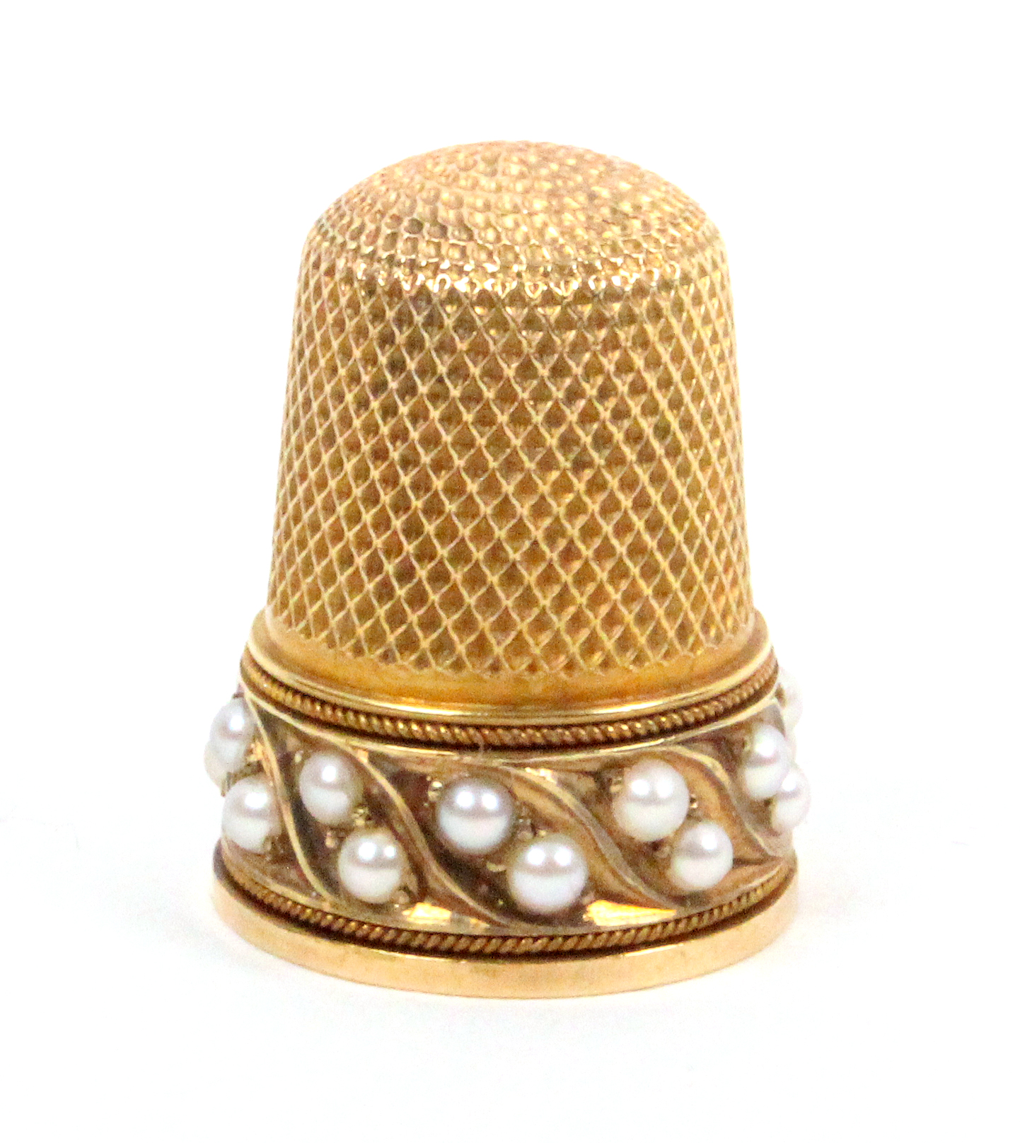 A 19th Century gold thimble with a border of pearls set in pairs in leaf form mounts between rope