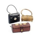 Three late 19th Century small format sewing companions comprising a dome top maroon leather