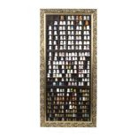 A large collection of modern thimbles contained in two wall mounting display cabinets, the