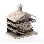 A continental silver thimble case in the form of a Swiss chalet, hinged at the roof line and