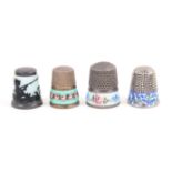 Three continental enamel decorated thimbles and another comprising a silhouette enamel example of