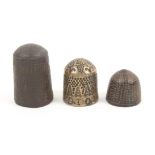 An 17th Century English metal thimble the scratch trellis ground with strapwork style decoration,