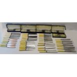 A matched set of twenty four Knives in two sizes by Wippell Brothers, together with two boxes of