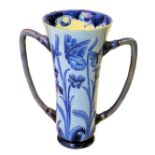 A William Moorcroft Macintyre Florian ware two handled cylindrical Vase decorated in blue with