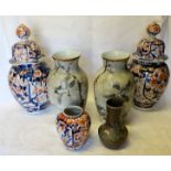 A pair of Japanese Imari pattern Vases and Covers decorated in orange and blue, 13" (33cms) high, (