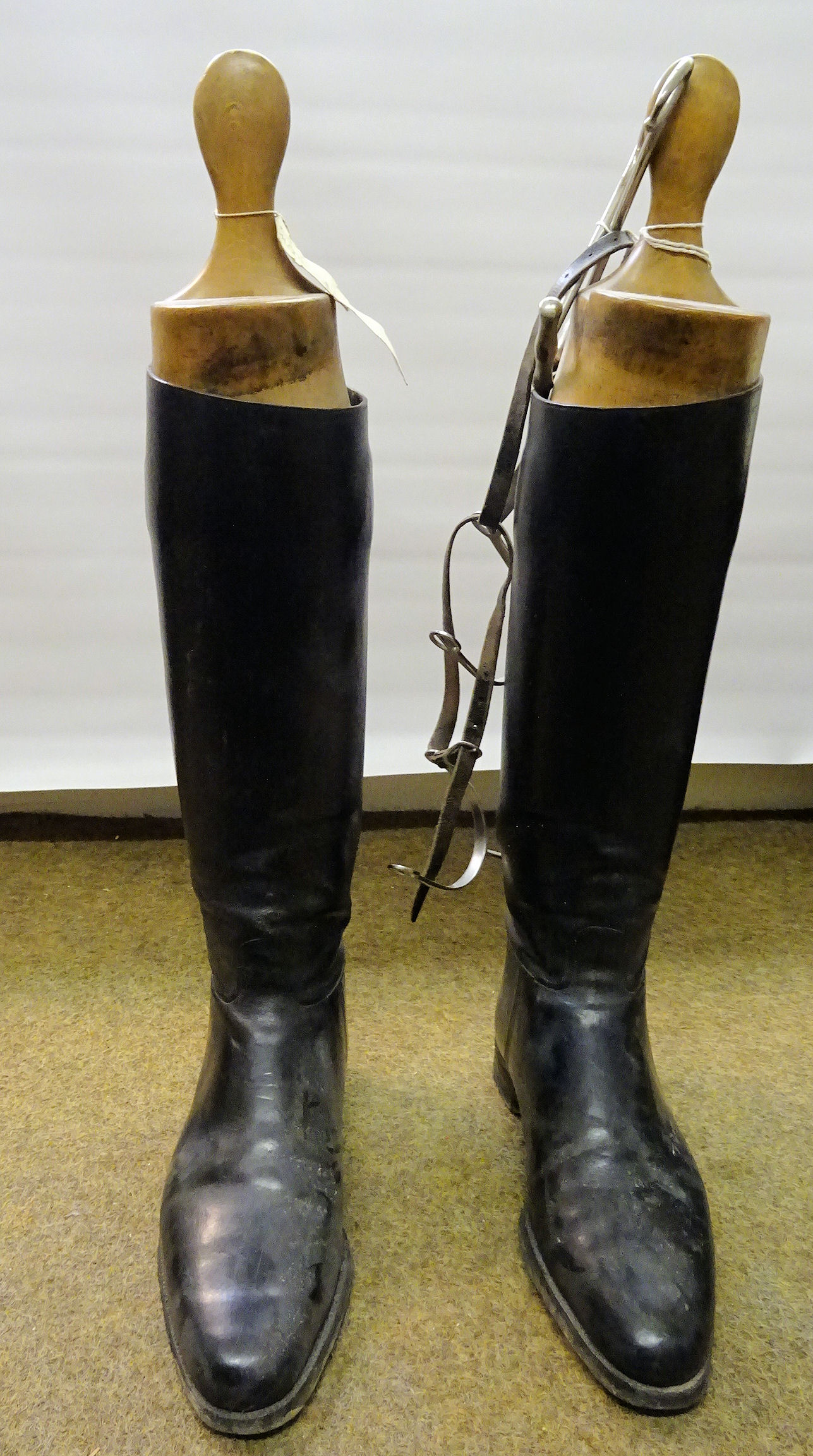 A pair of Gentleman's black Hunting Boots with wooden trees, boot pulls and spurs.