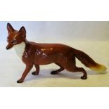 A Beswick model of a standing Fox in gloss finish, no. 1016a.