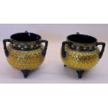 A pair of Doulton Lambeth cauldron shaped three handled Vases, decorated with gilt swirls, with a