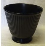 A Wedgwood black glazed Vase of ribbed design. 7 1/2" (19cms) high.