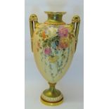 A Royal Worcester two handled baluster Vase decorated with a lightly raised pattern of flowers on