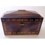 A Regency rosewood Tea Caddy inlaid with a floral design in cut brass, the interior, fitted with two