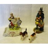 A Royal Doulton figure 'The Mask Seller' HN 2103 (a/f), two Beswick hounds and a Yardley soap dish.