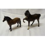 A Beswick Model of a horse in brown gloss, no.1549 with head tucked, first version and a Beswick