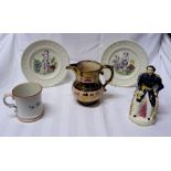 A Staffordshire pottery seated figure of Prince Albert, two 19th Century alphabet plates, a 19th