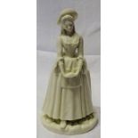 A Royal Worcester white glazed standing figure of a lady. 8" (20cms) high.