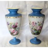 A pair of French porcelain baluster Vases painted with floral sprays insects etc with a pale blue