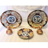 A pair of Japanese Imari pattern Plates decorated in orange and blue with flowers etc. 12" (31cms)