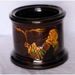 A Royal Doulton Kingsware Tobacco Jar decorated with a figure smoking a pipe. 6" (15cms) diameter,