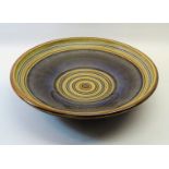 A Denby Bowl decorated in blue and brown. 12" (31cms) diameter.