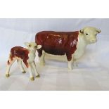 A Beswick model of a Hereford Cow, no. 1360 and a Hereford calf no. 1406b.