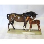 A Beswick Model of a brown mare and a chestnut foal on an oblong base, no.1811.