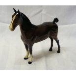 A Beswick model of a Hackney Horse, no. 1361 in brown gloss.