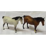 A Beswick model of grey swish tailed Horse, no. 1182, first version and another swish tailed horse