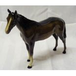 A Beswick model of a Racehorse, no. 701, second version, in brown gloss.