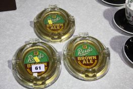 3 'Reids brown ale' ash trays